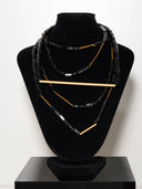 collana gentilis 3 fili perline nere  bacchette dorate