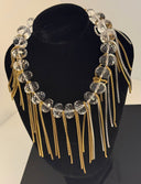 choker mezzi cristalli trasparenti s forma leggermente schiacciata fili color oro e argento , elastico